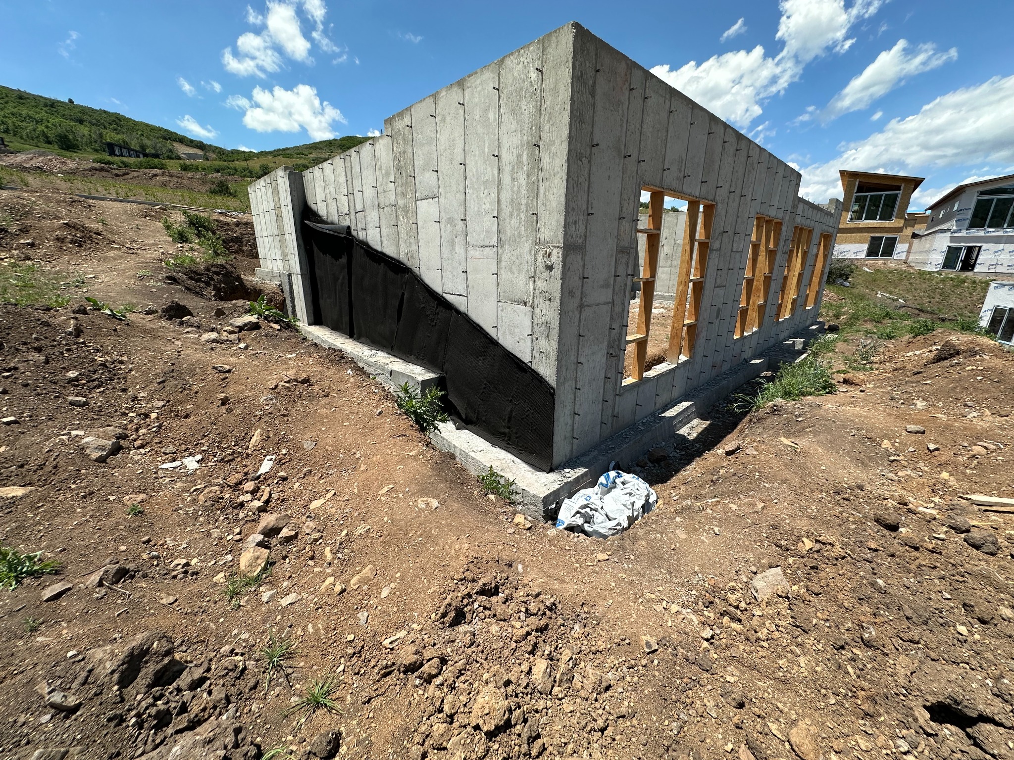 Active construction foundation work at a mountain home site