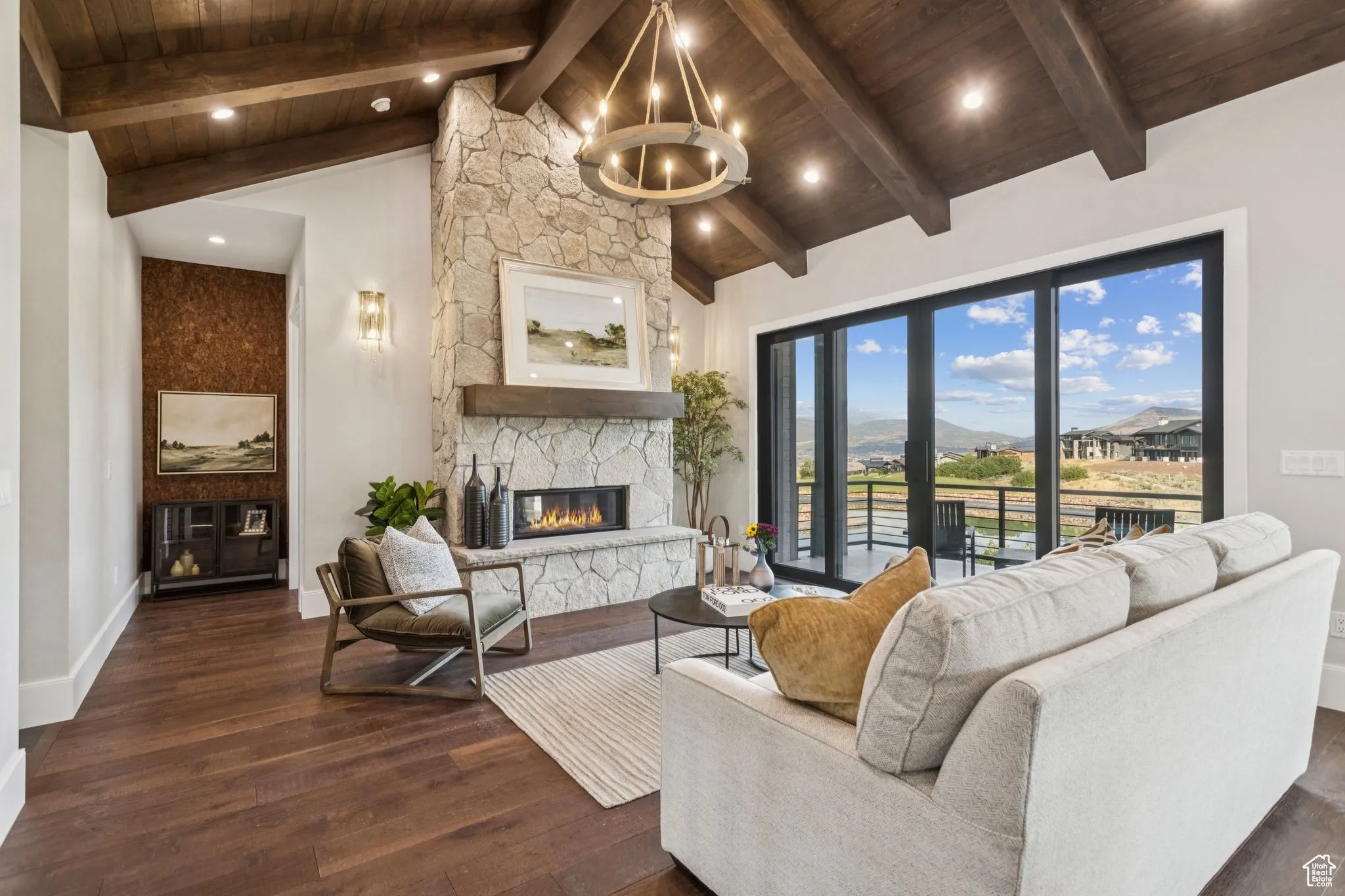 Completed living room with stone fireplace and warm wood finishes