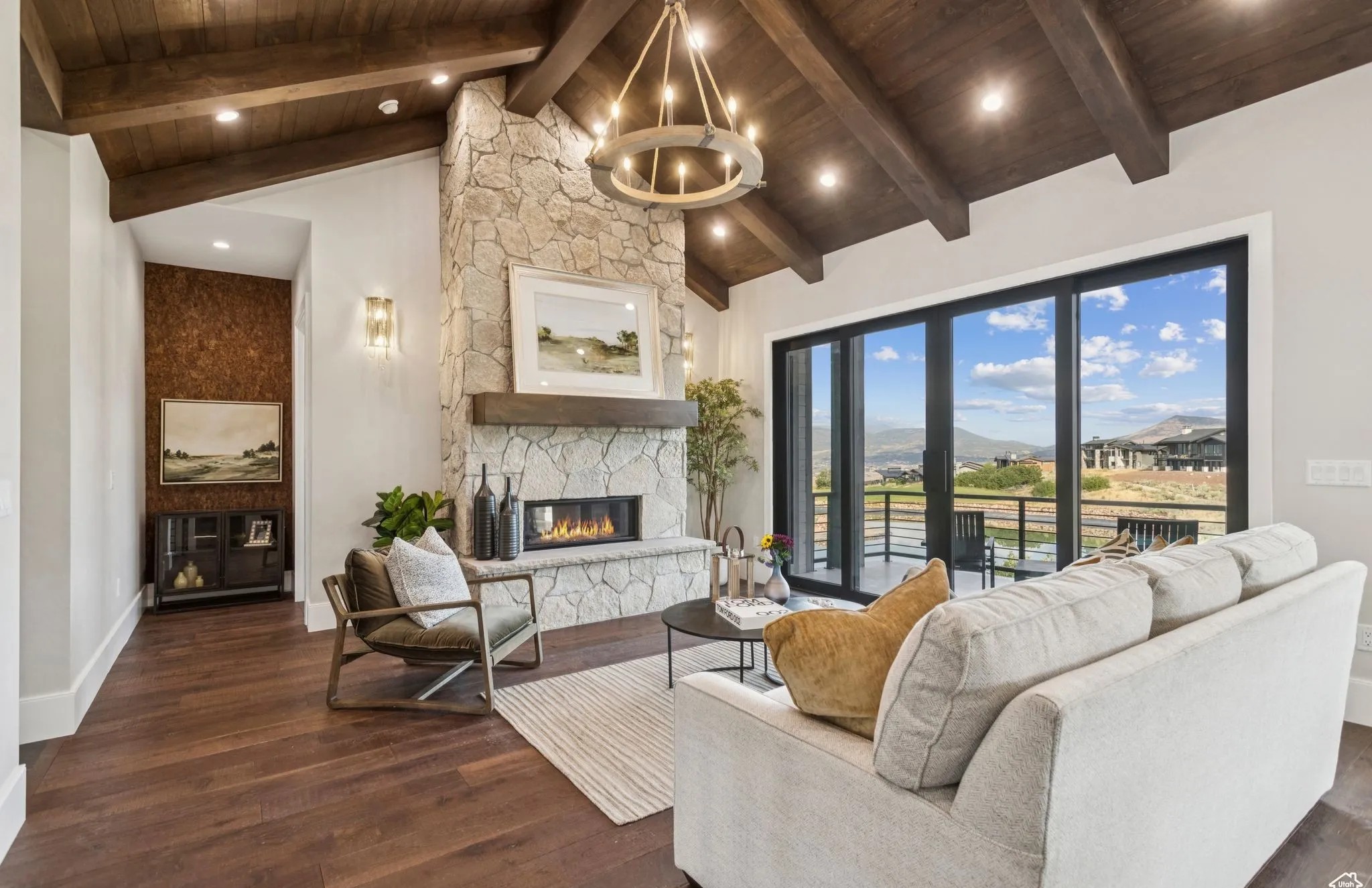 Living room with stone fireplace and warm tones