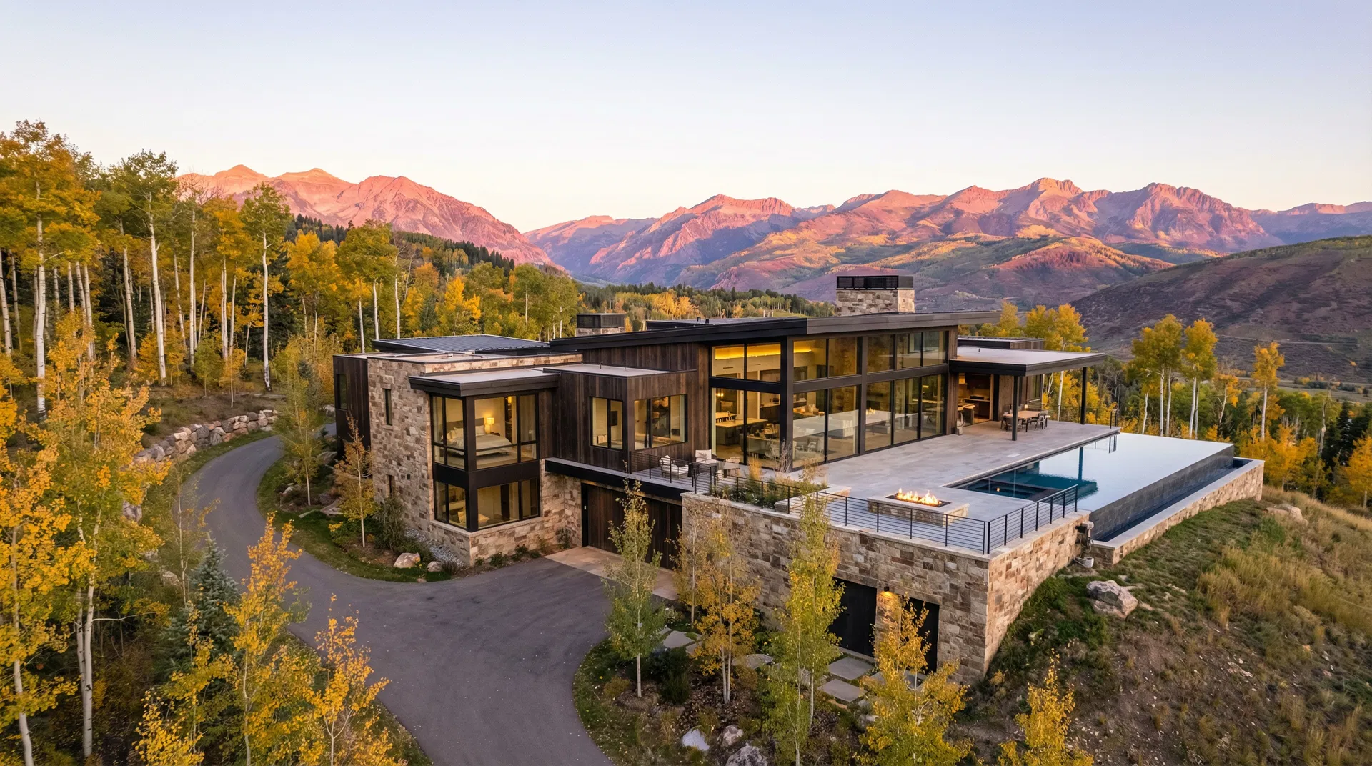 Aerial view of completed custom home among fall aspens in the Wasatch Back