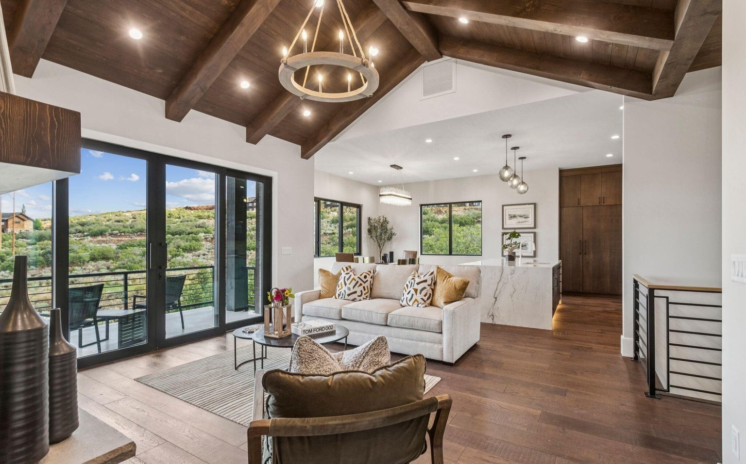 Living room wide angle showing sliding doors and mountain views