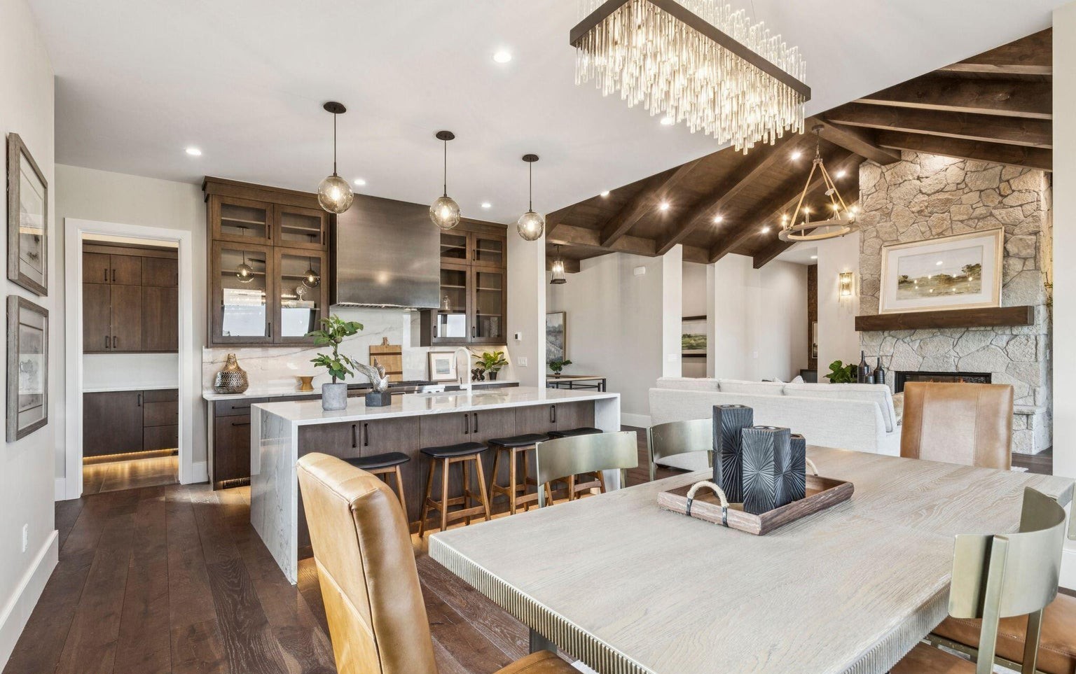 Kitchen and dining area with crystal chandelier and open concept flow