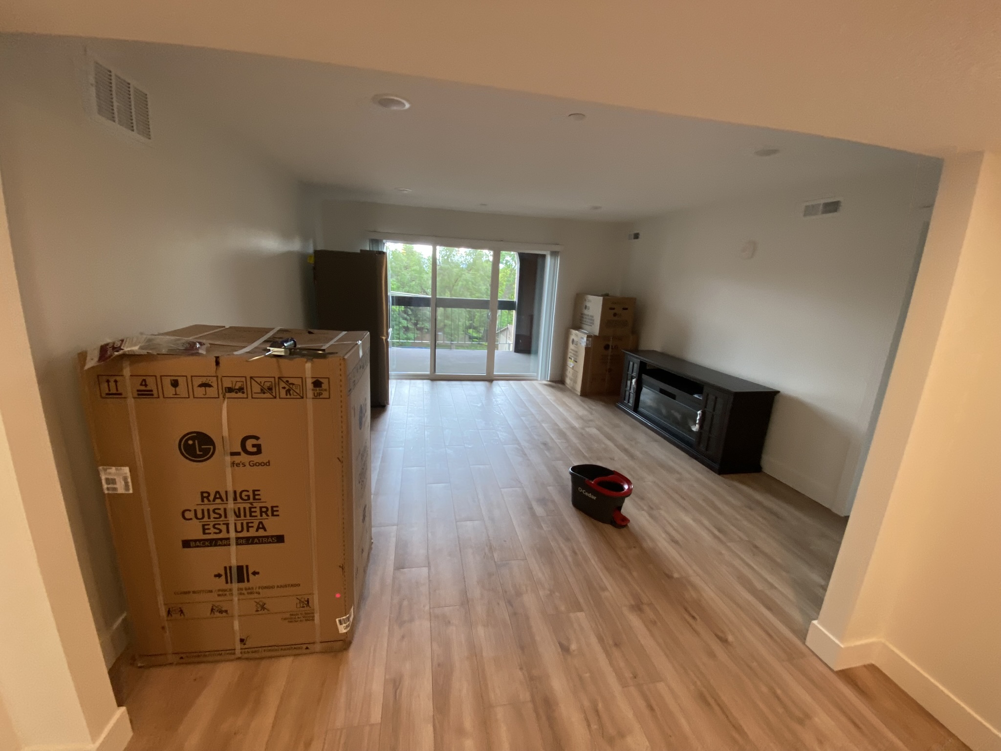 Living room with sliding glass door to balcony
