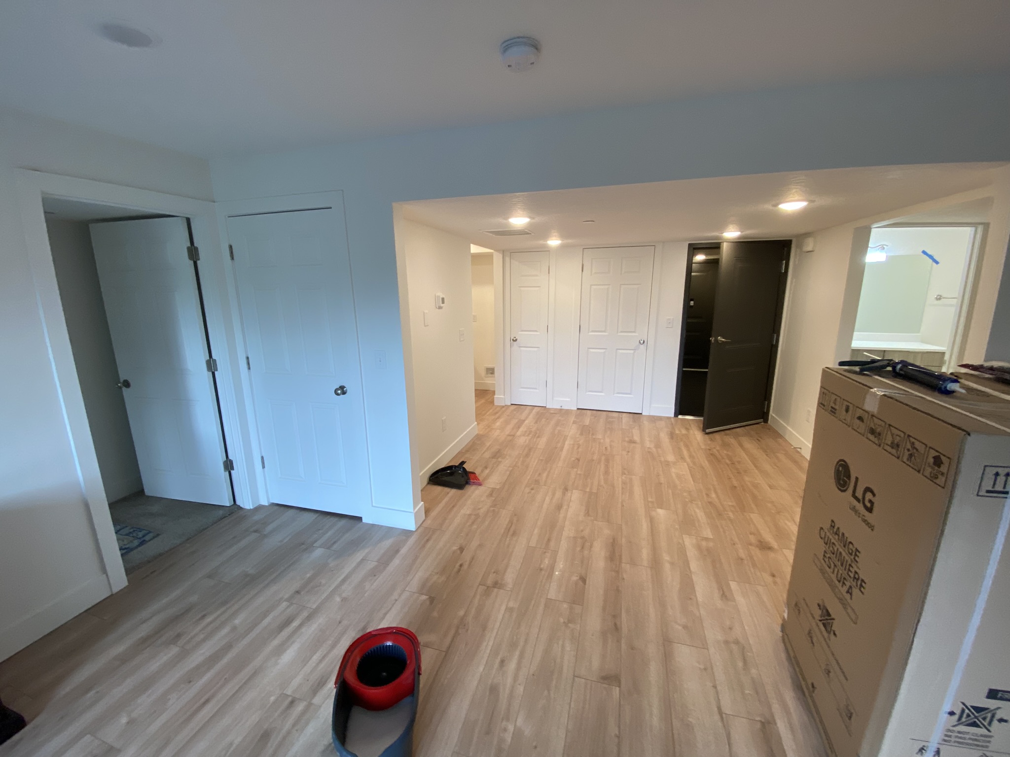 Wide view of living area showing full renovation scope