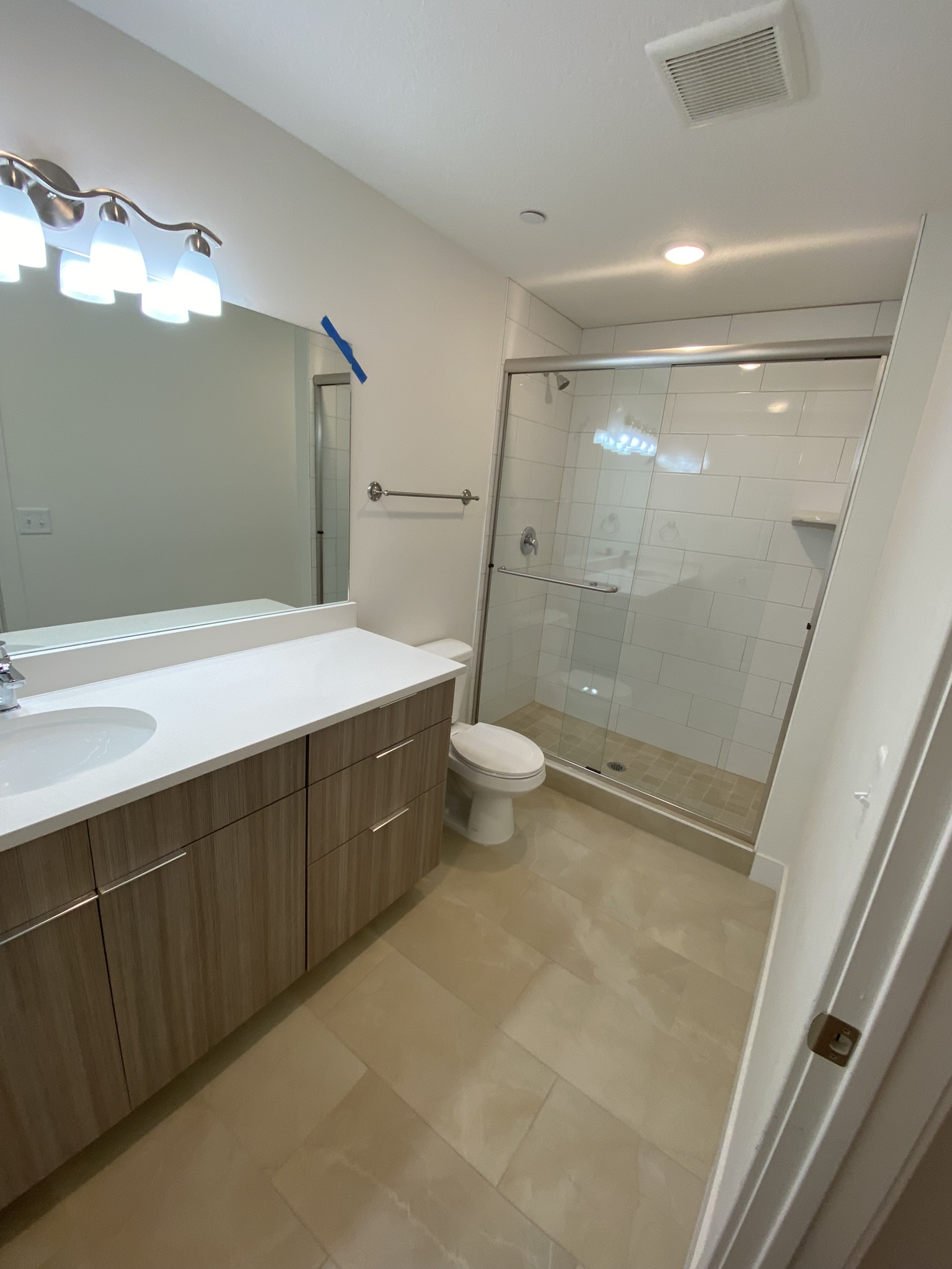 Primary bathroom with glass shower enclosure