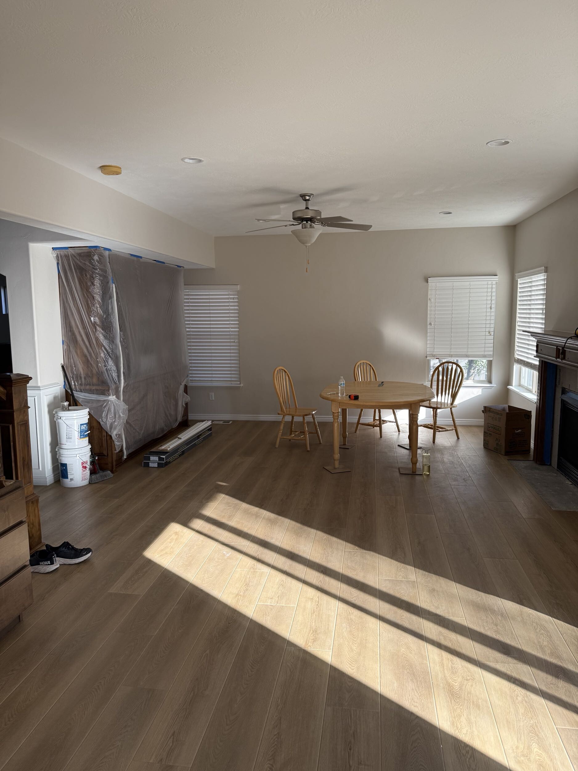 Main living area with new luxury vinyl plank flooring and fresh paint — Eagle Mountain remodel complete