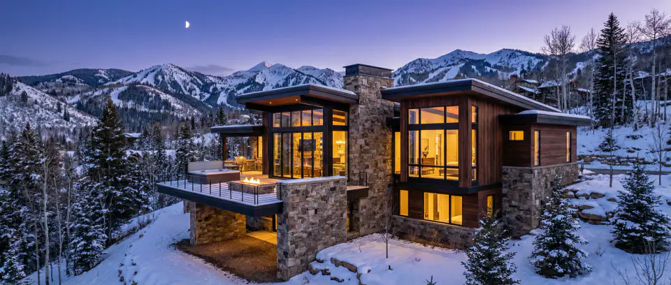 Luxury mountain home at twilight — Three Peak Construction service area