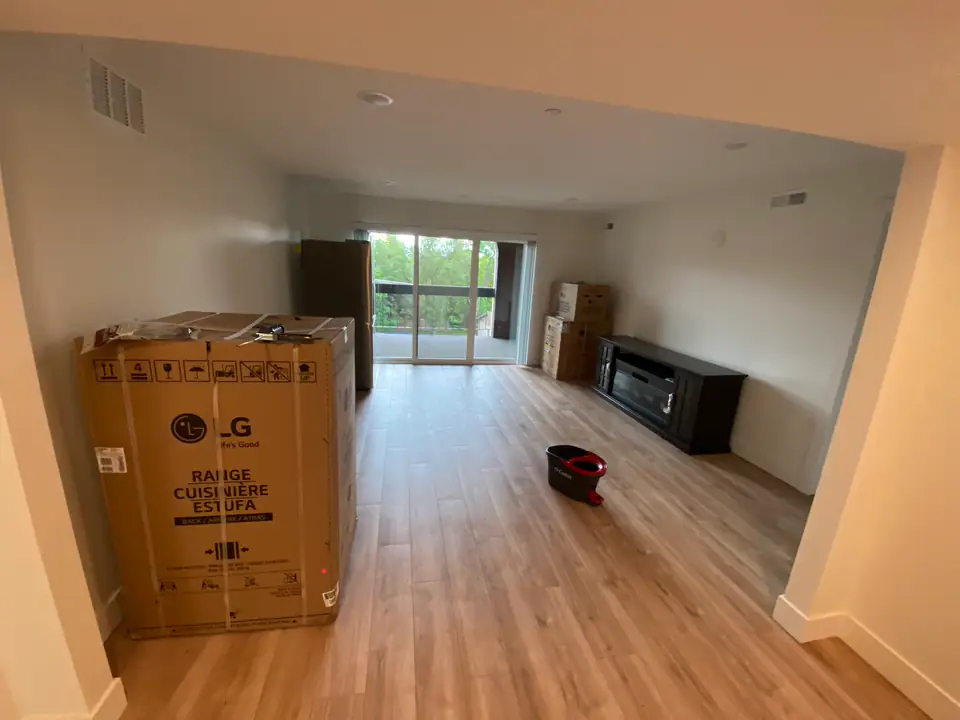 Living room with sliding glass door to balcony