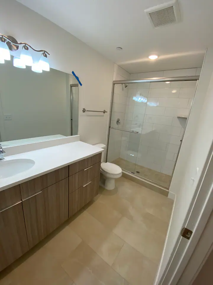 Primary bathroom with glass shower enclosure