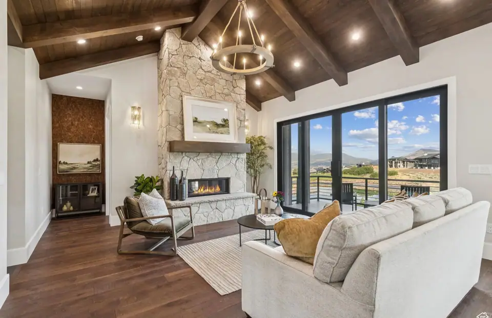 Living room with stone fireplace and warm tones